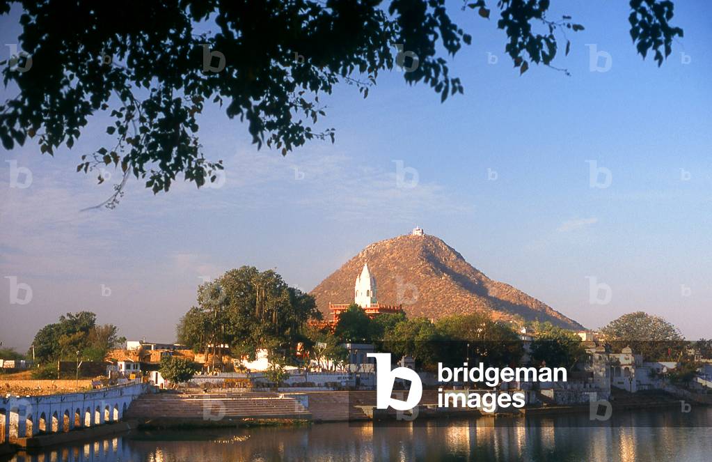 India: The Savitri Temple atop Ratnagiri Hill overlooks the ghats (holy stairs) surrounding Pushkar's holy lake, Rajasthan