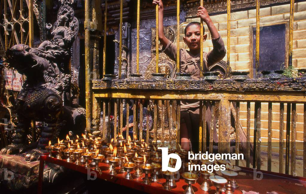 Nepal: A young boy and the Golden Temple (Hiranyavarna Mahavihara), Patan, Kathmandu Valley (1998)