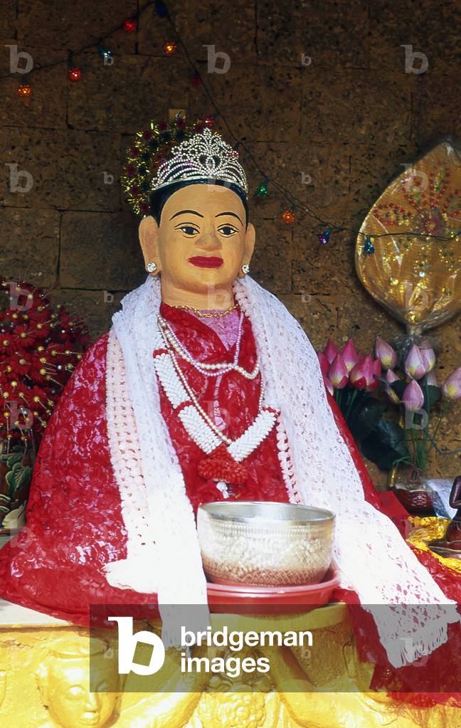 Cambodia: A statue of Penh, the founder of Phnom Penh, Wat Phnom, Phnom Penh