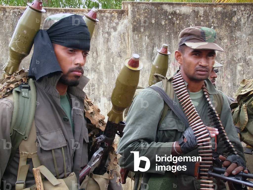 Sri Lanka: Heavily armed Sri Lanka Army soldiers preparing to advance on LTTE positions, c. 2008.