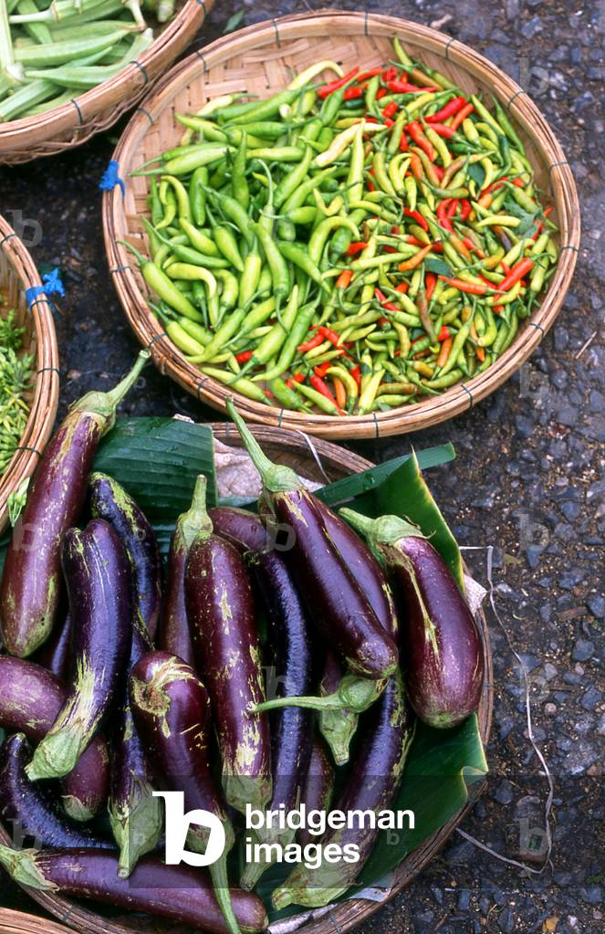 Vietnam: Aubergines and chillis in a Vietnamese market