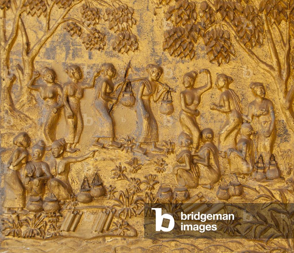 Laos: Village scene, golden bas-relief at the entrance to the sim (ordination hall), Wat Mai Suwannaphumaham, Luang Prabang