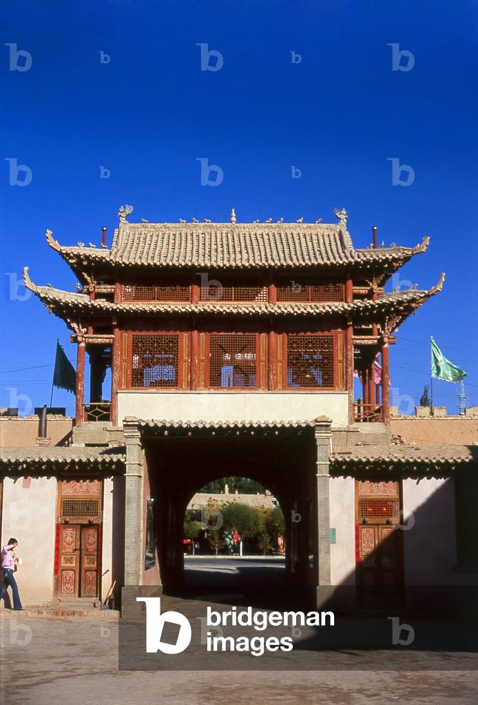 China: An old caravanserai, now a museum, next to the sand dunes of Mingsha Shan (Mingsha Hills) in the Kumtagh Desert, Dunhuang, Gansu Province