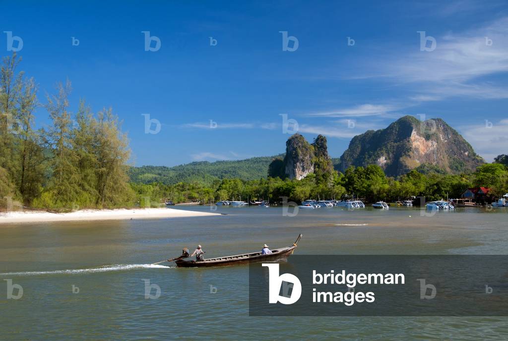 Thailand: A boat returns from the islands, Hat Noppharat Thara, Krabi Province