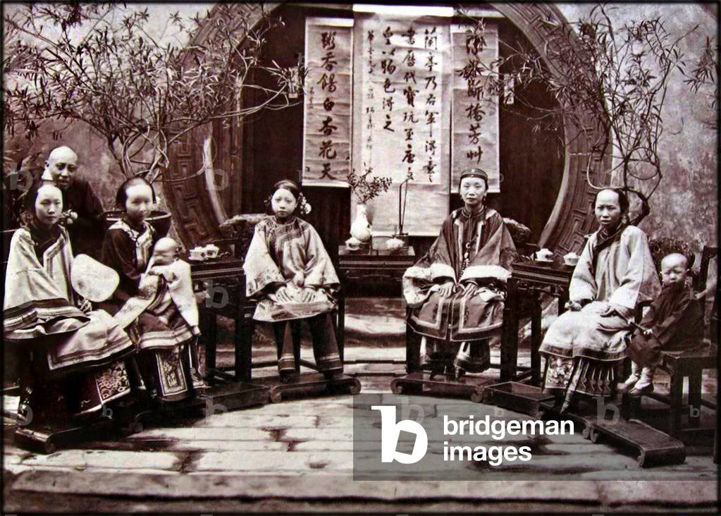 China: A wealthy family seated in a group, 1885.