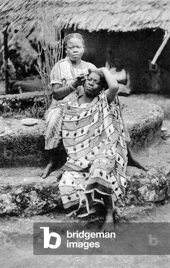 Tanzania / Zanzibar: Street hair stylist at work, early 20th century