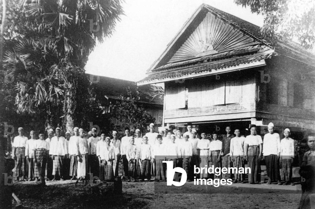 Cambodia: Muslim students and teachers pose for a photograph in 1918 outside their madrassa in Phnom Penh.