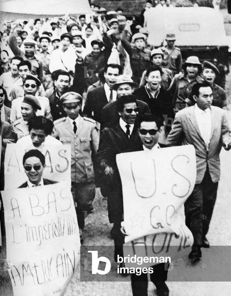 Laos: Pro-communist demonstrators demonstrating against US Imperialism in the streets of Vientiane (Viangchan) near the end of the Second Indochina War, c.1974-1975.