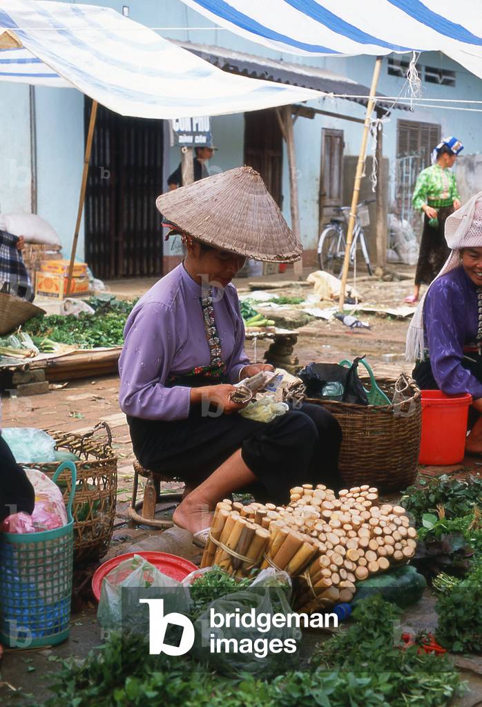 Vietnam: Tai women selling vegetables in the market at Thuan Chau, Northwest Vietnam