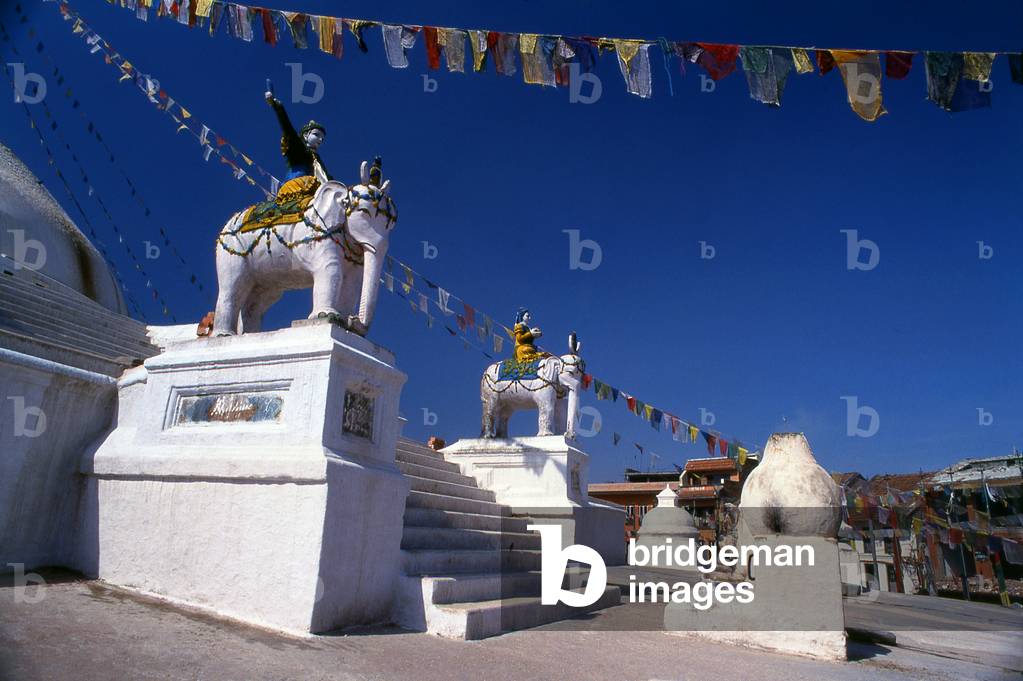 Nepal: Elephant statues on the staircase leading to the great dome of Bodhnath (Boudhanath) stupa, Kathmandu