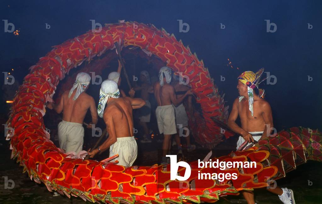 China: Miao men perform an elaborate dragon dance at a festival near Guiyang, Guizhou