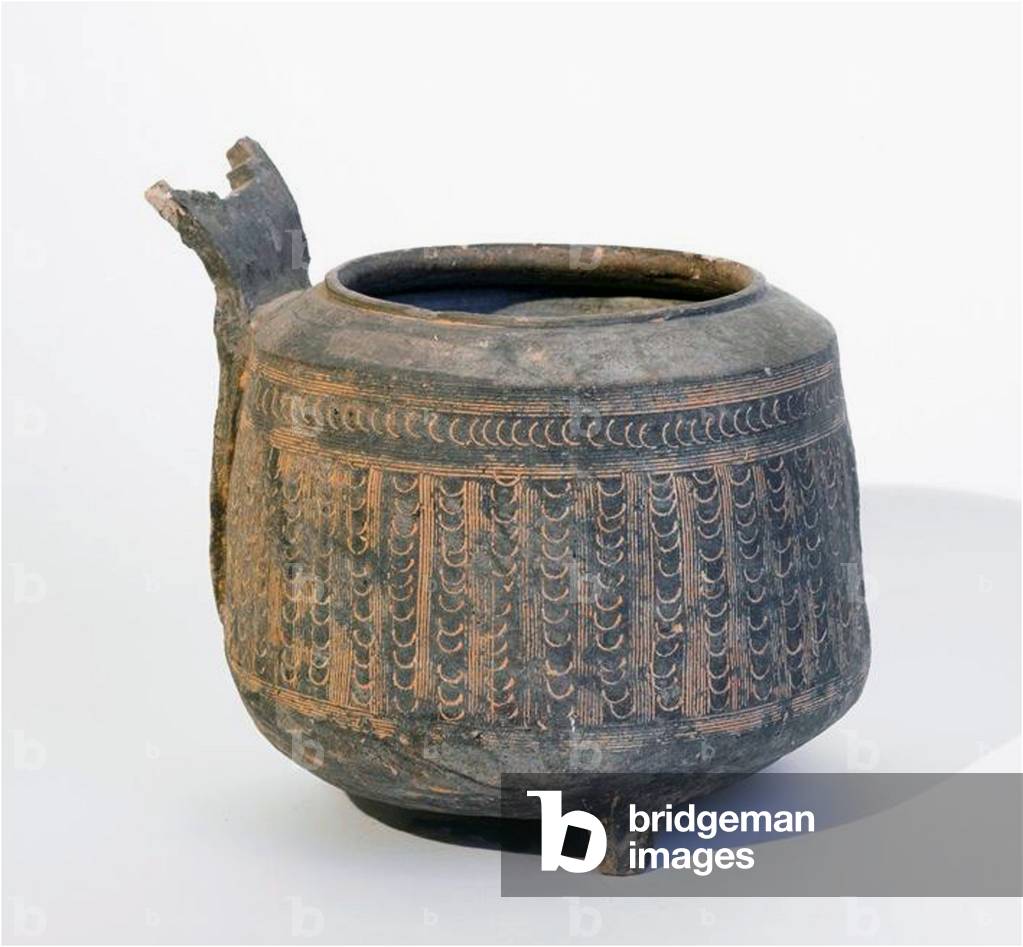 Vietnam: Tripod vessel with handle, incised pattern encrusted with red pigment, Dong Son Culture, c.500-100 BCE