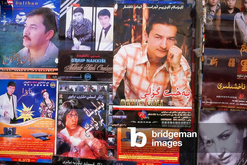 China: Movie posters on a wall in Khotan, Xinjiang Province