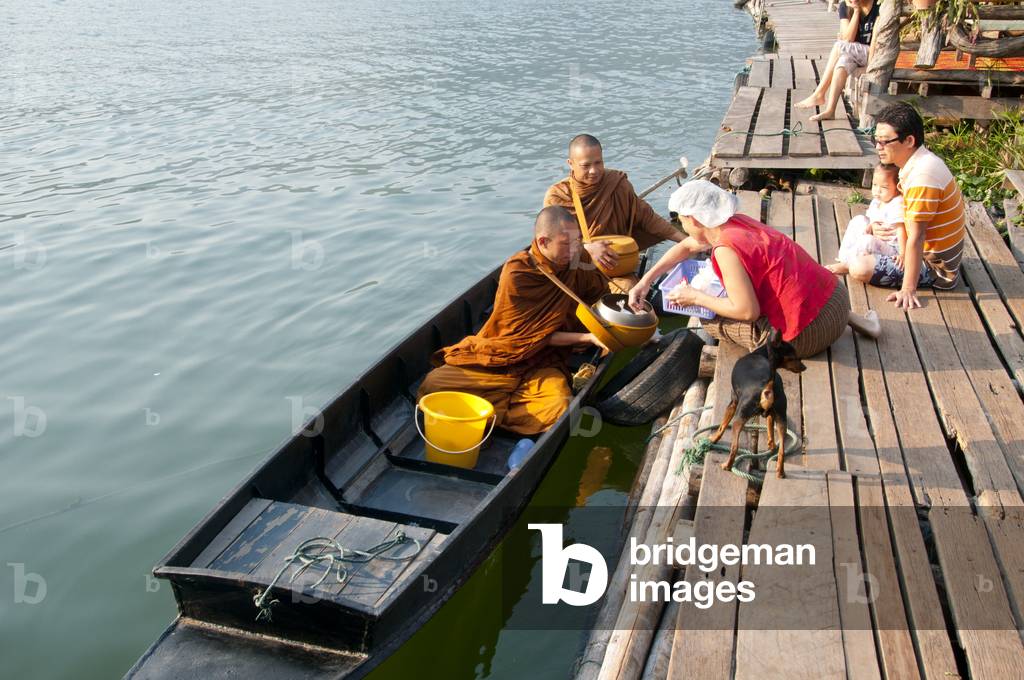 Thailand: Monks on their early morning almsround on the lake at the Mae Ngat Dam, near Chiang Mai, northern Thailand