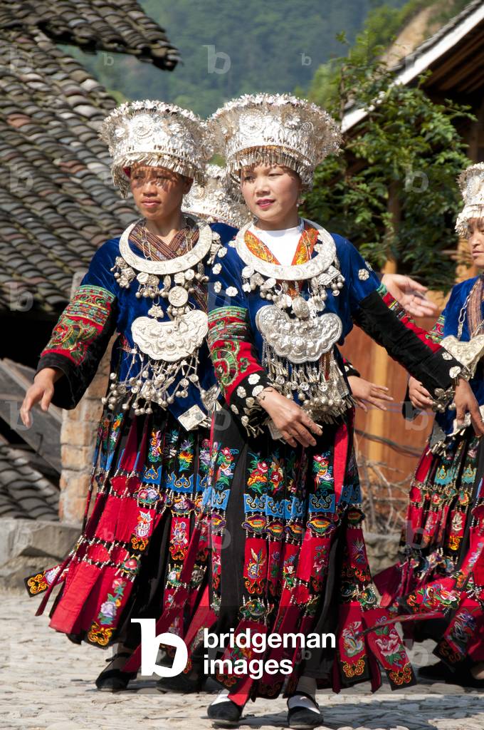 China: Miao women dancing in the village of Langde Shang, southeast of Kaili, Guizhou Province
