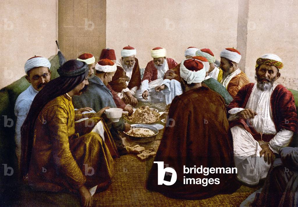 Palestine: Druze men of Mount Carmel (Arabic Jabal Mar Elyas; Hebrew Har ha Karmell) sharing a meal, c. 1900