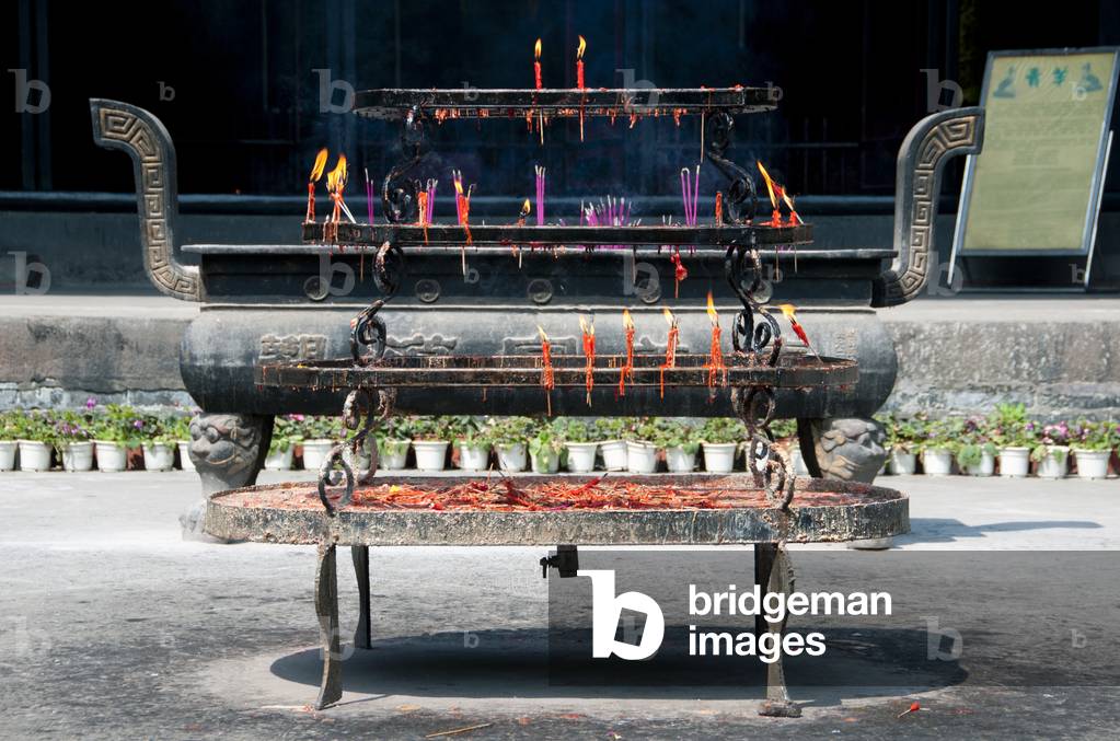 China: Candles and incense burn in the Qingyang Gong (Green Goat Temple), Chengdu, Sichuan Province