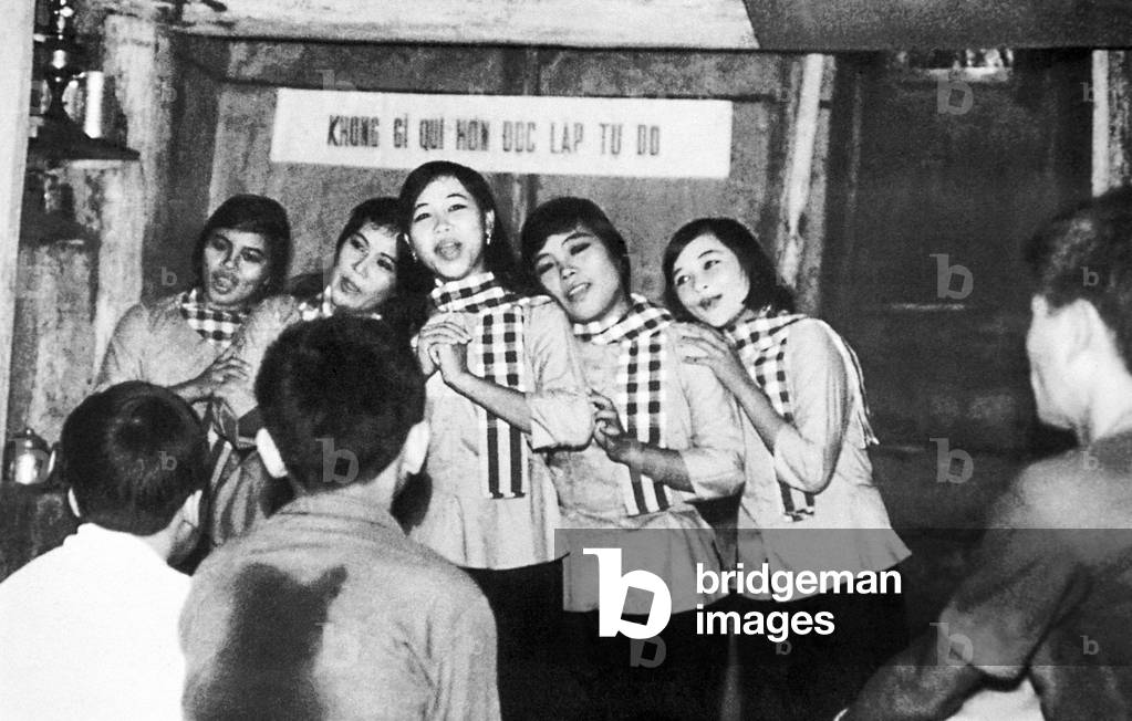 Vietnam: NLF (Viet Cong) female folk dance group singing underground at Cu Chi, 1972