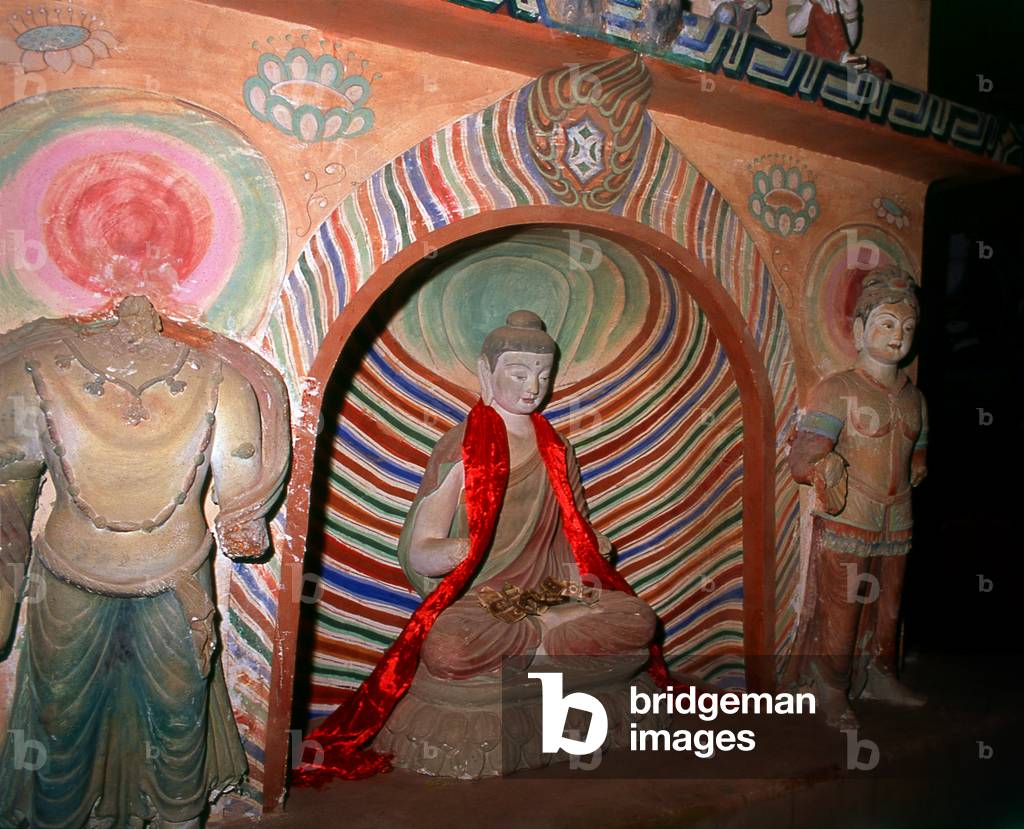 China: Buddha image within the dark recesses of the Dafo Si (Great Buddha Temple), Zhangye, Gansu Province