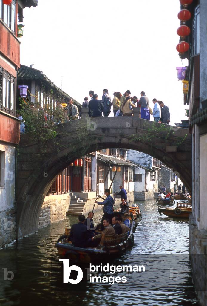 China: Boats and bridge on a canal in the 'Water Town' of Zhouzhuang, Jiangsu Province