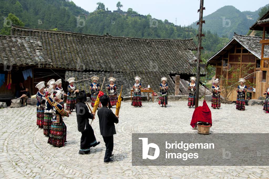 China: Miao women dancing in the village of Langde Shang, southeast of Kaili, Guizhou Province