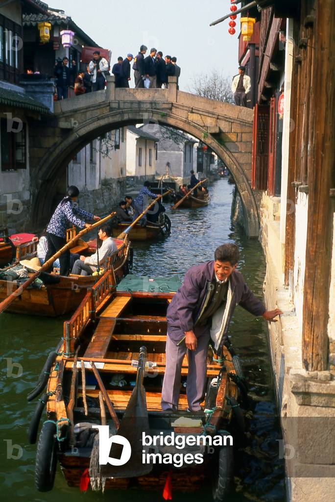 China: Boats and bridge on a canal in the 'Water Town' of Zhouzhuang, Jiangsu Province