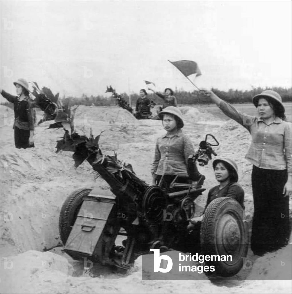 Vietnam: Vietnam's 'Long-Haired Army' - women soldiers of the PAVN (People's Army of Vietnam) firing howitzers, Second Indochina War, c. 1965
