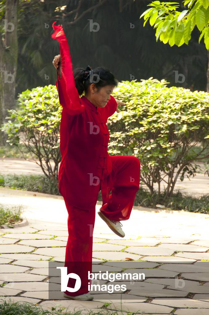 China: Renmin Gongyuan (People's Park) plays host to a variety of early morning exercise activities. Chengdu, Sichuan Province