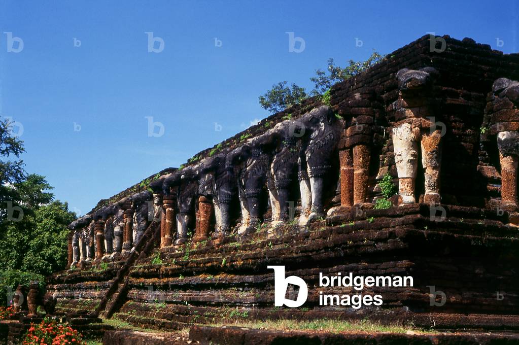 Thailand: Some of the 68 elephants surrounding the base of the Ceylonese-style chedi, Wat Chang Rob, Kamphaeng Phet Historical Park