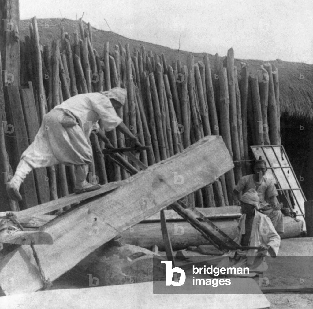 Korea: Two men working in a lumber mill, Seoul, early 20th century