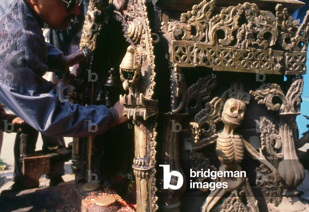 Nepal: Skeleton man at a Ganesh shrine, Kathmandu (1996)