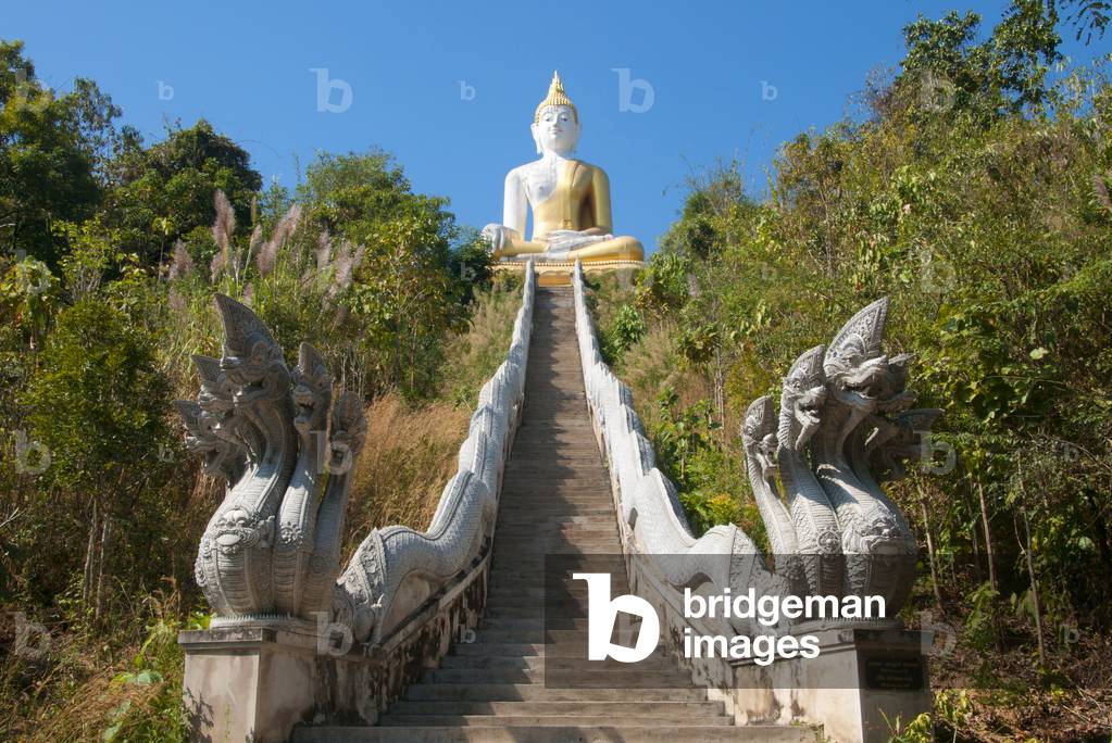 Thailand: A naga (mythical snake) staircase leads up to a giant Buddha on a hill overlooking Wat Salaeng, Ban Chom Khwan, Amphoe Long, Phrae Province