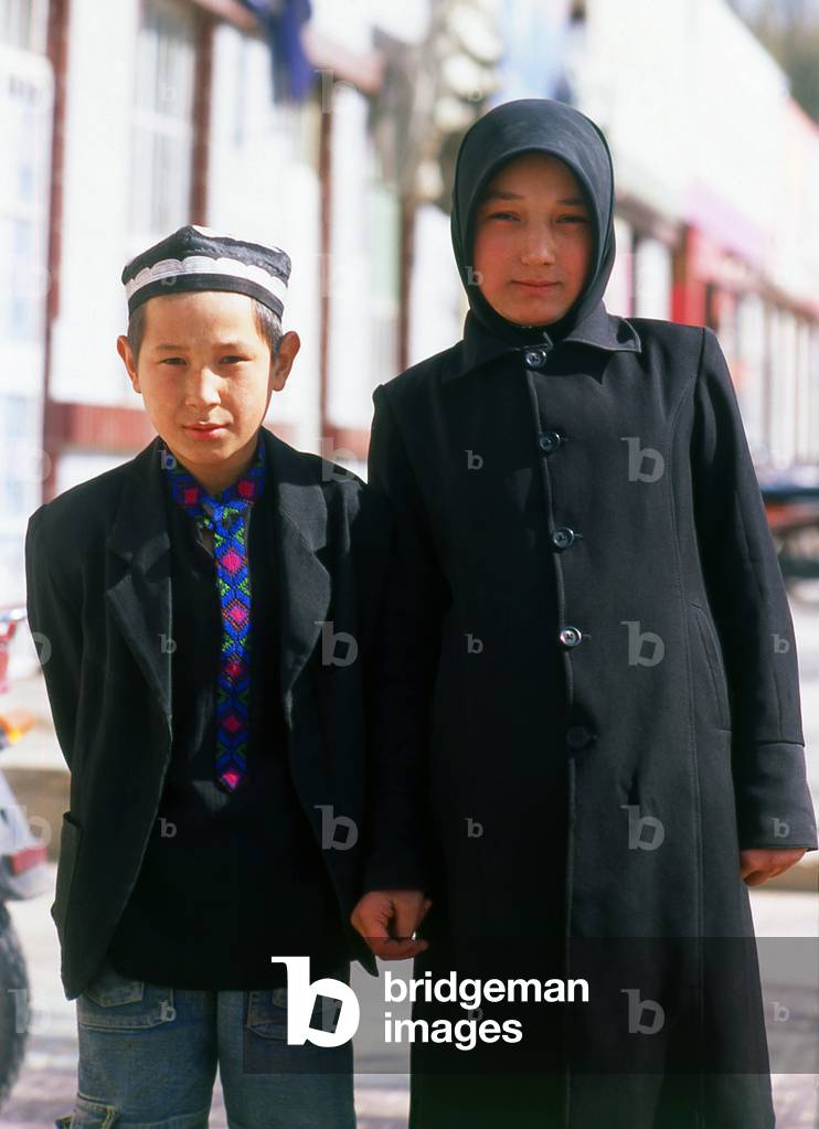 China: Young Uighur brother and sister in Khotan, Xinjiang Province