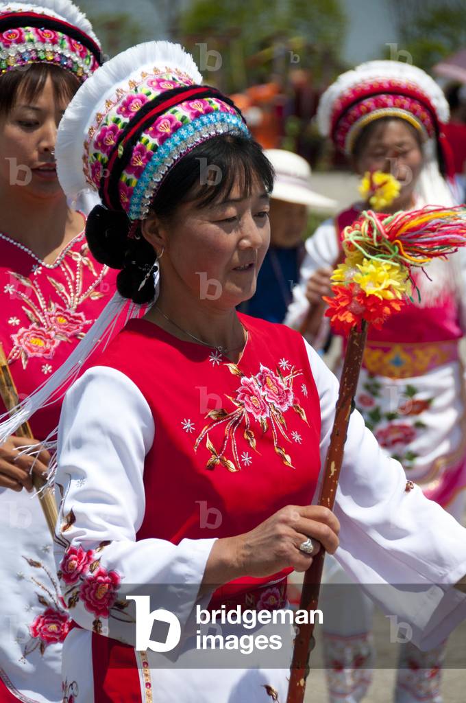China: Bai woman dancing at the Bai music and dance festival at San Ta Si (Three Pagodas), Dali, Yunnan