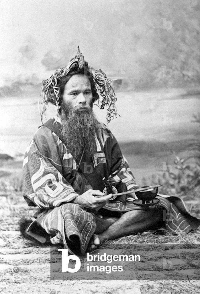 Japan: Ainu man with  'ikupasuy' prayer stick, Hokkaido, 1901