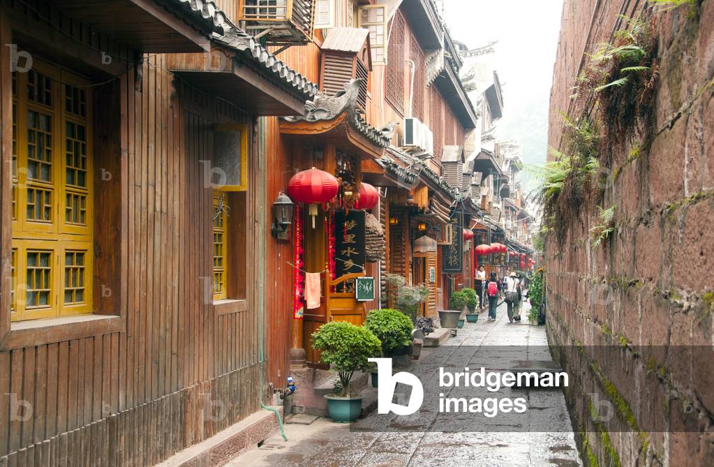 China: Old housing tight up to the ancient city wall, Fenghuang, Hunan Province