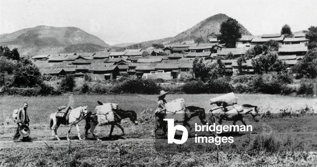 China: Ethnic Haw traders, photographed in 1910 with a caravan of pack horses.
