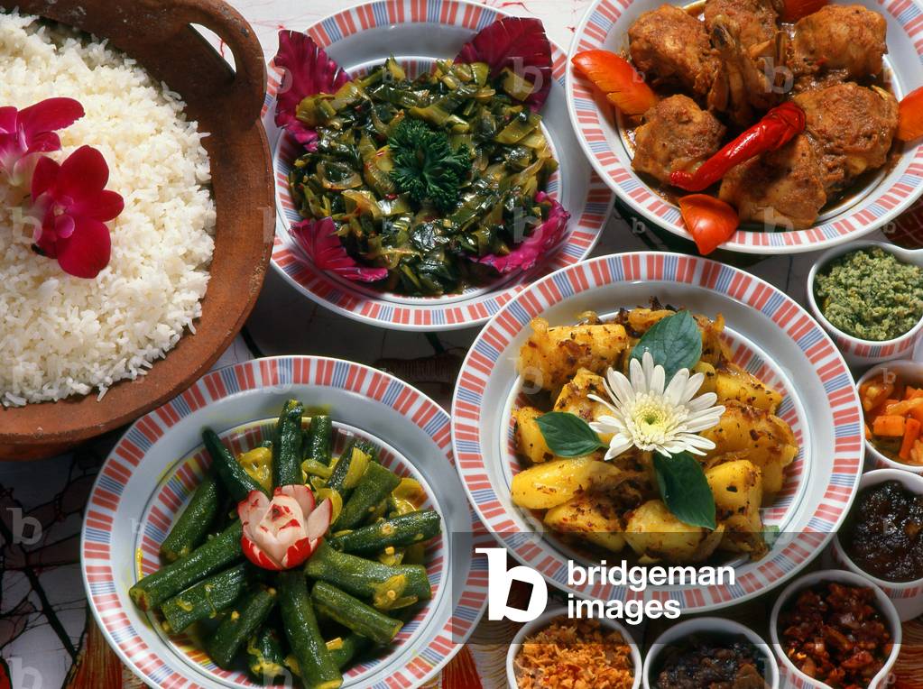 Sri Lanka: A spread of typical Sri Lankan curries and white rice accompanied by a variety of pickles and chutneys