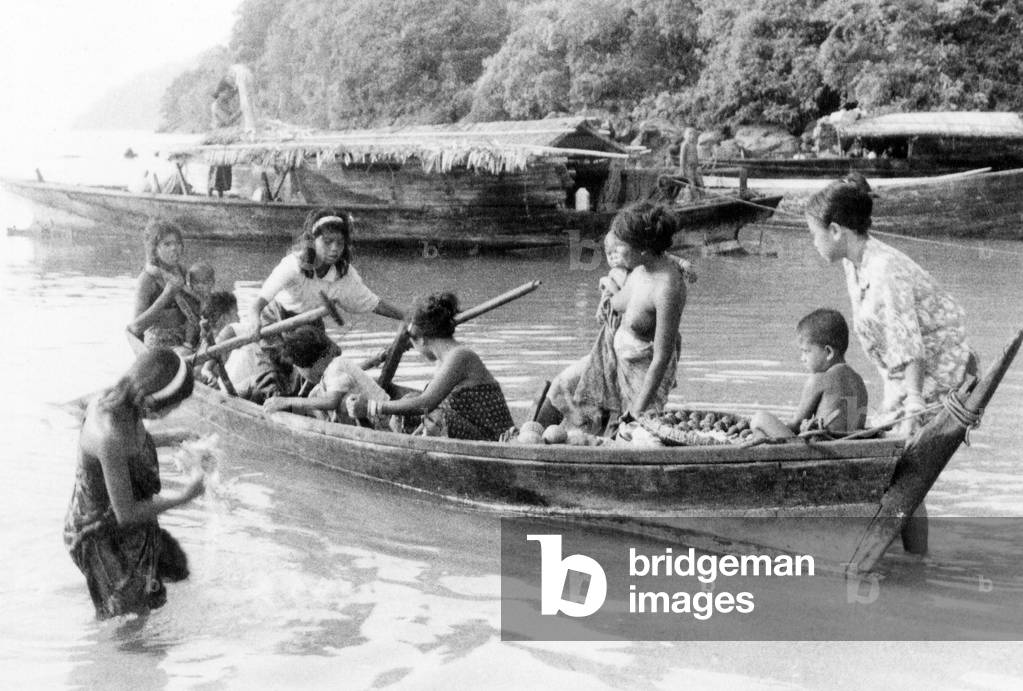 Thailand: Chao Thalae 'Sea Gypsy' women and children with boats, Phuket, c.1960