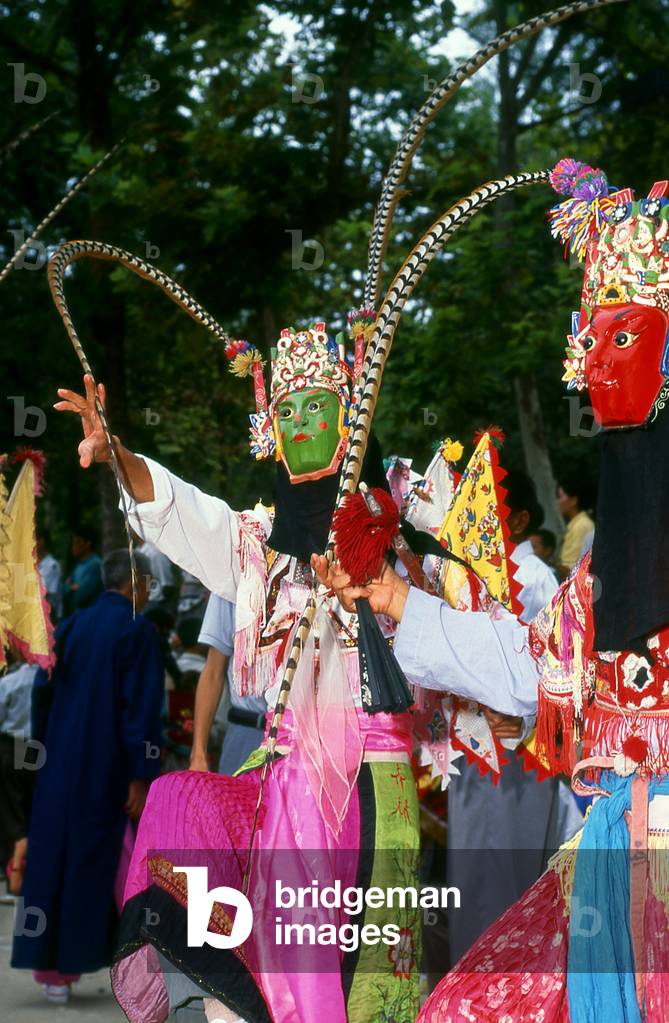 China: Miao mask performance at a festival near Huangguoshu, Guizhou Province