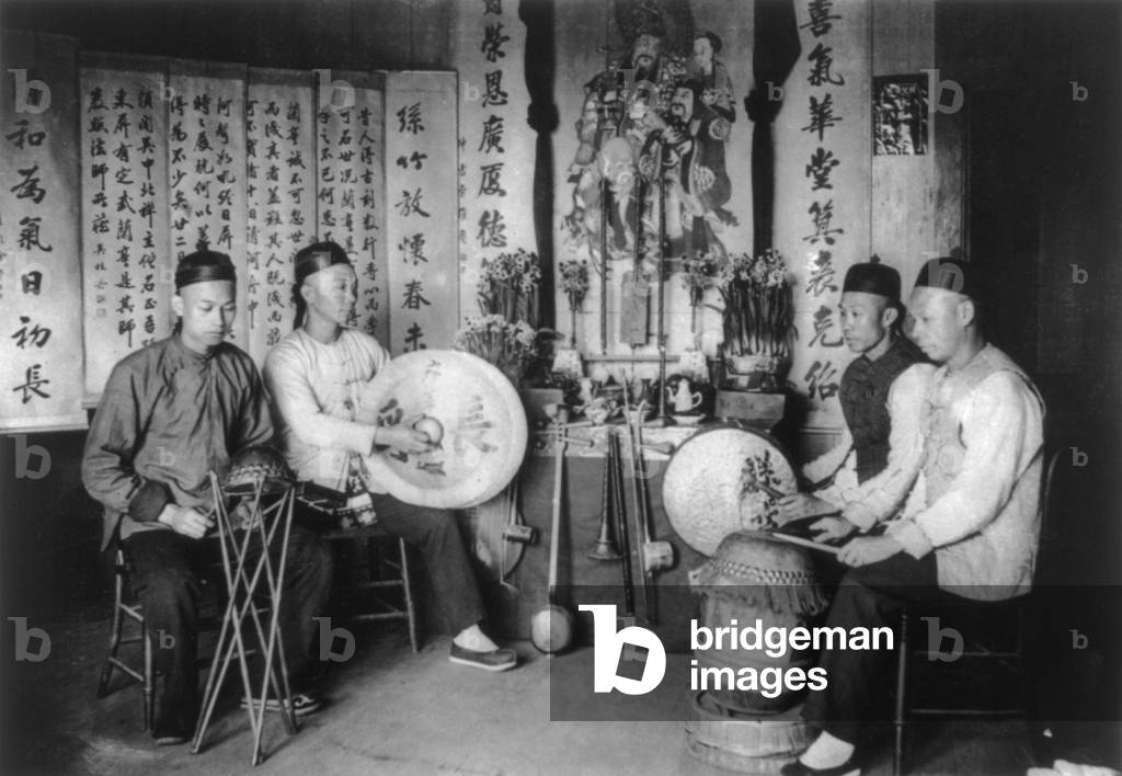Korea: A 'Chinese' band. Chinese men with musical percussion instruments, Seoul, early 20th century