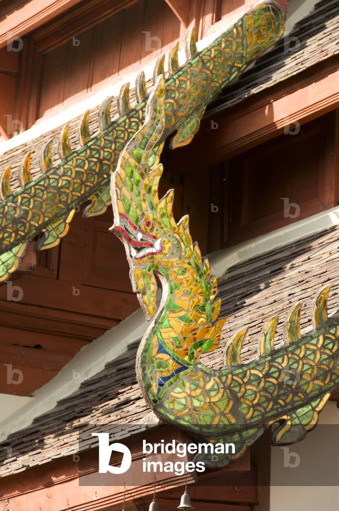 Thailand: Cho fa (sky hook) styled like a naga (mythical snake) at the end of a decorated  bargeboard, viharn, Wat Phrathat Doi Kham, Chiang Mai