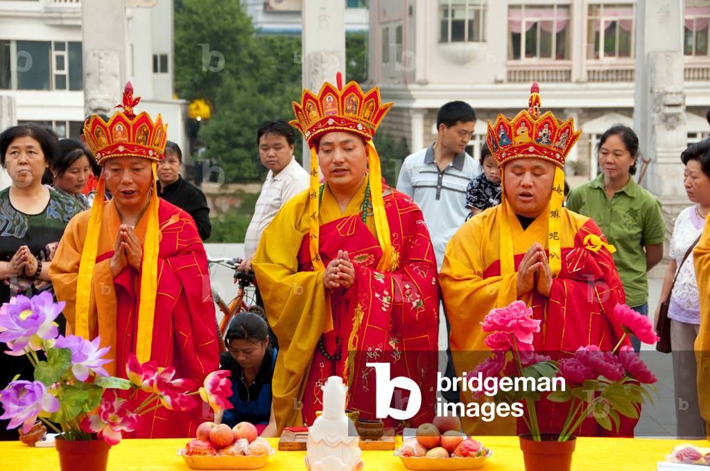 China: Elaborate late afternoon Buddhist rituals outside Ming-era Qianming Si (Qianming Temple), Guiyang, Guizhou Province