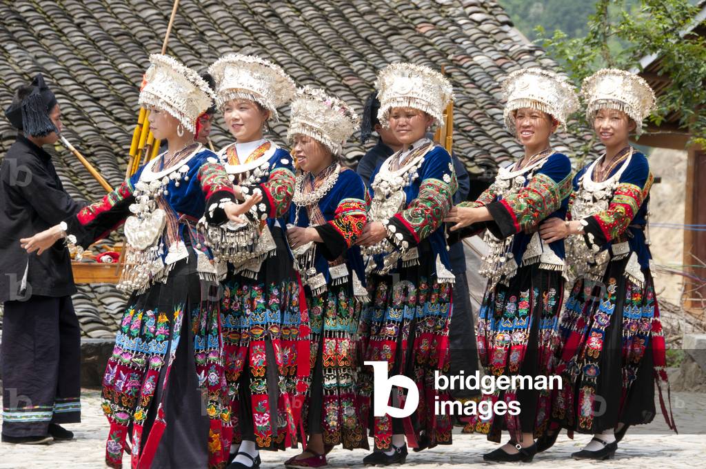 China: Miao women dancing in the village of Langde Shang, southeast of Kaili, Guizhou Province