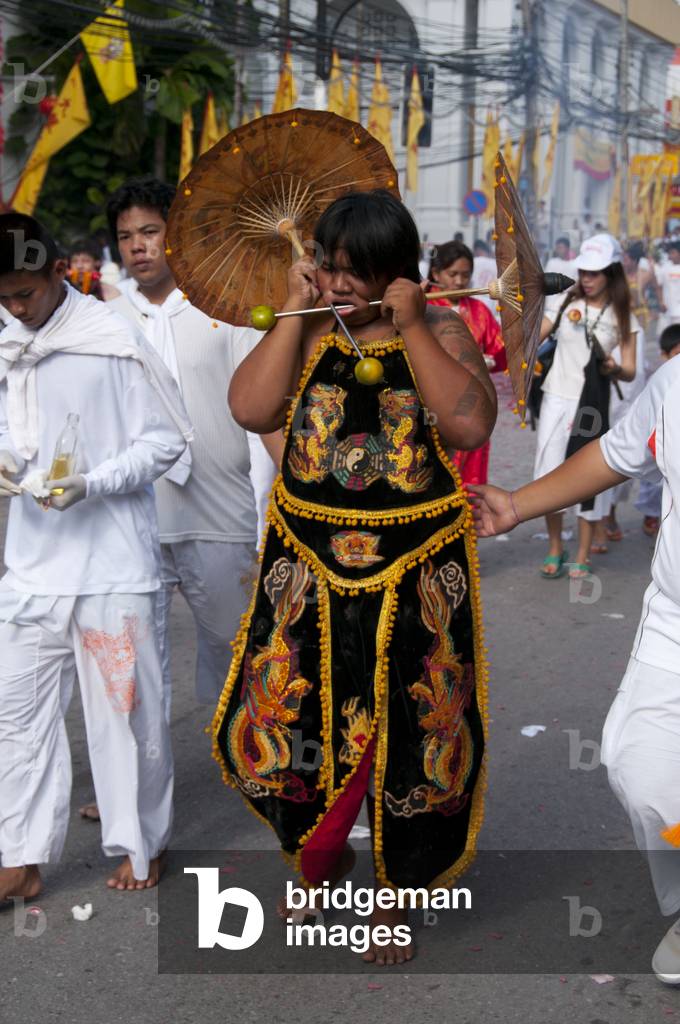 Thailand: Entranced devotee or 'Ma Song' takes part in a procession through Phuket Town, Phuket Vegetarian Festival