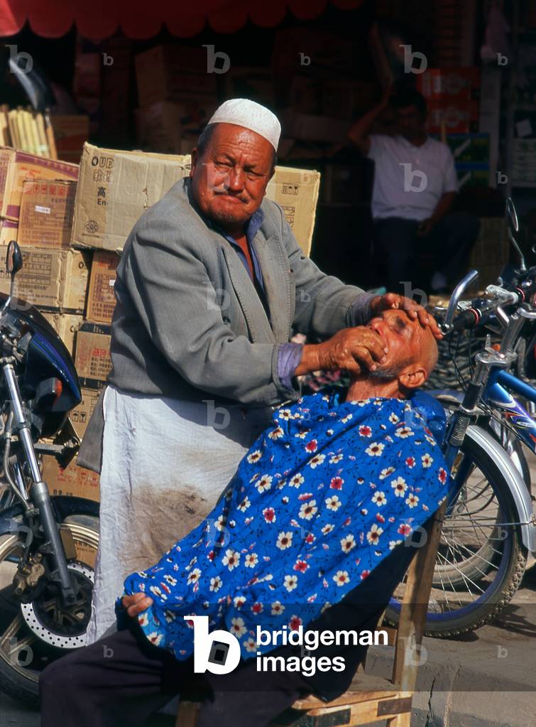 China: A shave in the sun, Kashgar, Xinjiang Province