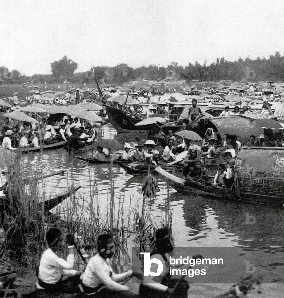 Thailand: Buddhist pilgrims head to the temple of Phra Chedi Klang Nam in the port of Rayong, some 100km southeast of Bangkok, c. 1900.