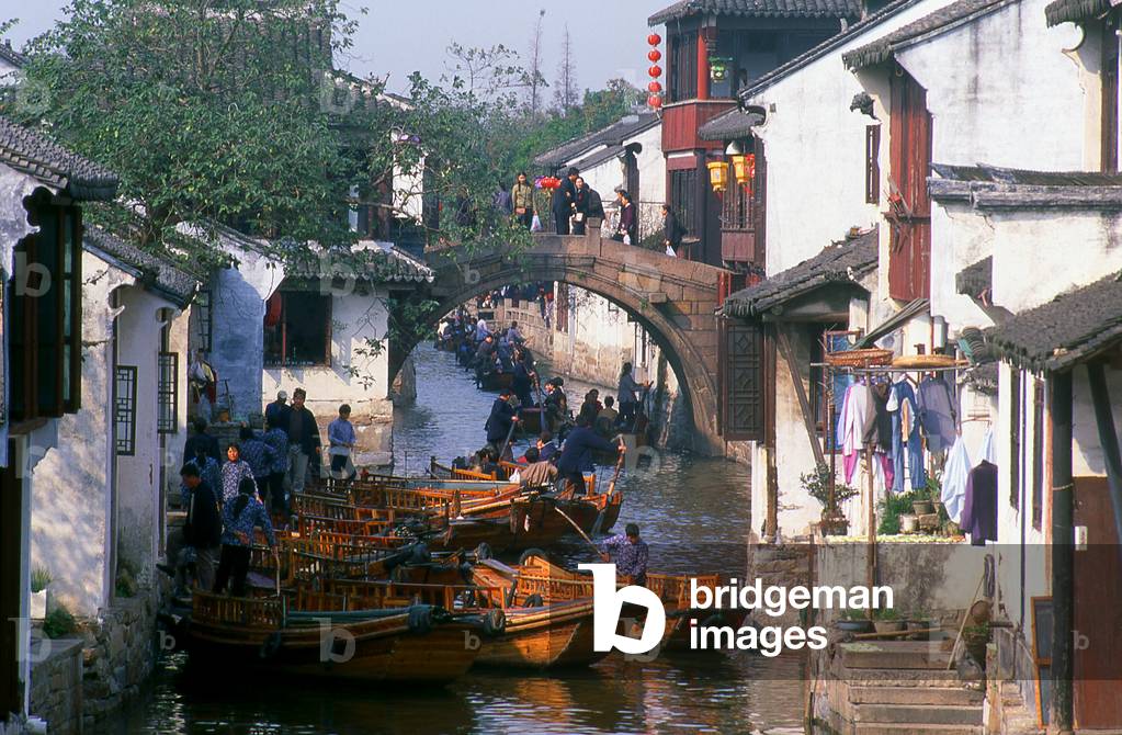 China: Boats and bridge on a canal in the 'Water Town' of Zhouzhuang, Jiangsu Province