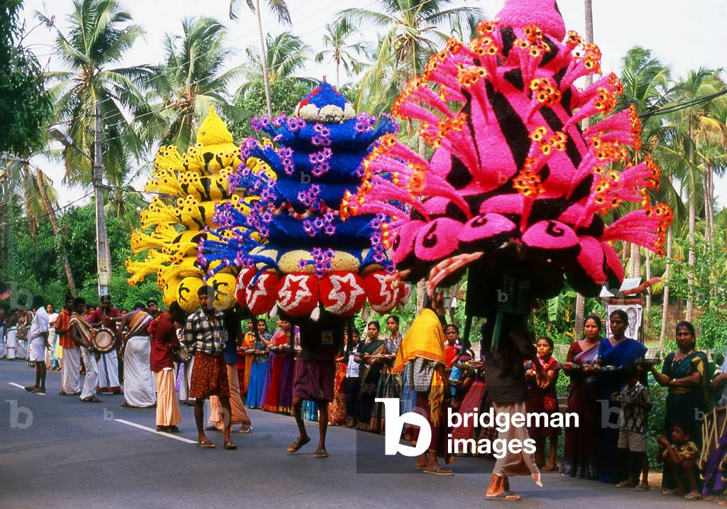 India: A local temple festival procession winds its way through a small village on its way to a temple, Kozhikode (Calicut) District, northern Kerala