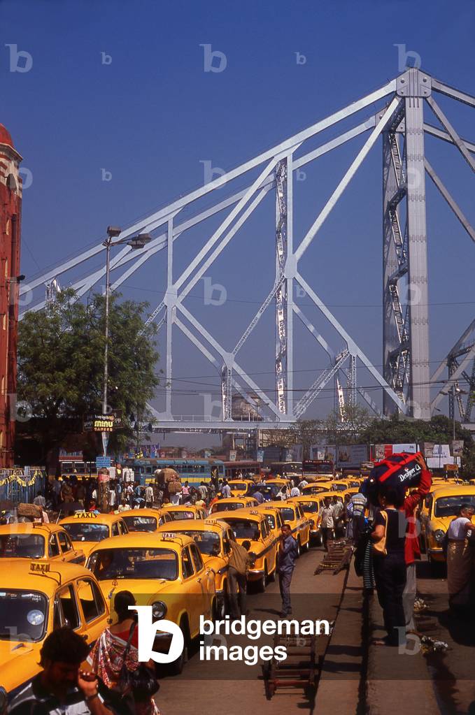 India: Taxis await custom near the Howrah Bridge and Howrah Railway Station, Kolkata (Calcutta), West Bengal